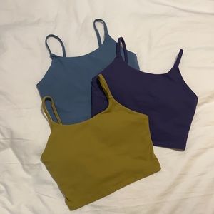 SOLD. UNAVAILABLE. 3 for $18 Muse Only size small tank tops. Built in bras